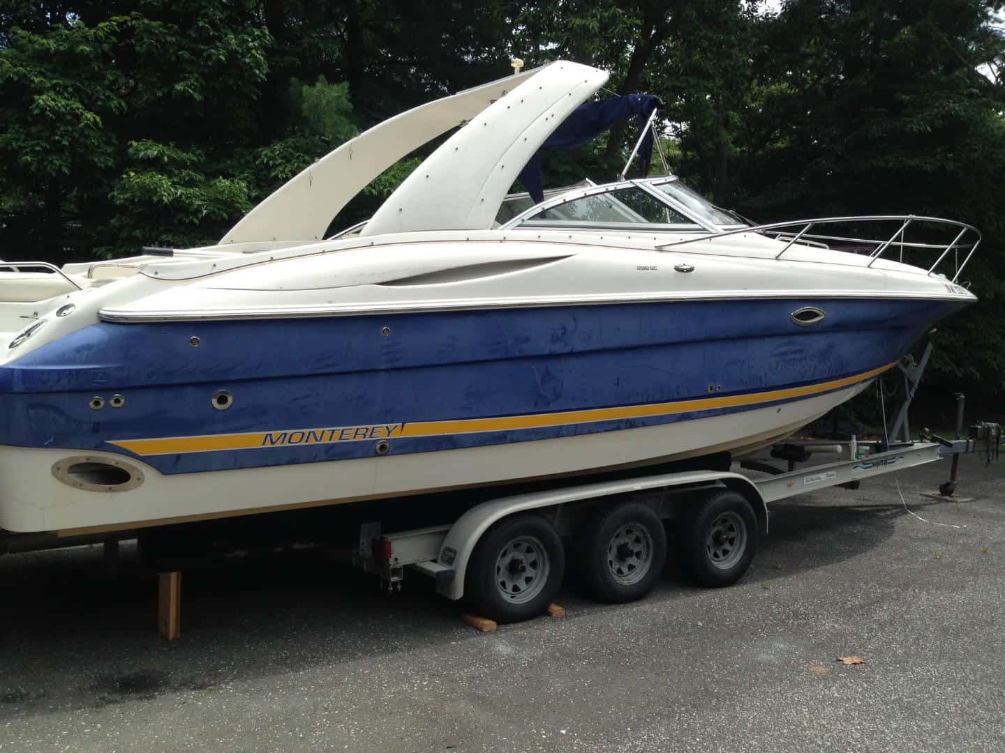 Monterey bowrider on a trailer with a restored deep blue gel coat