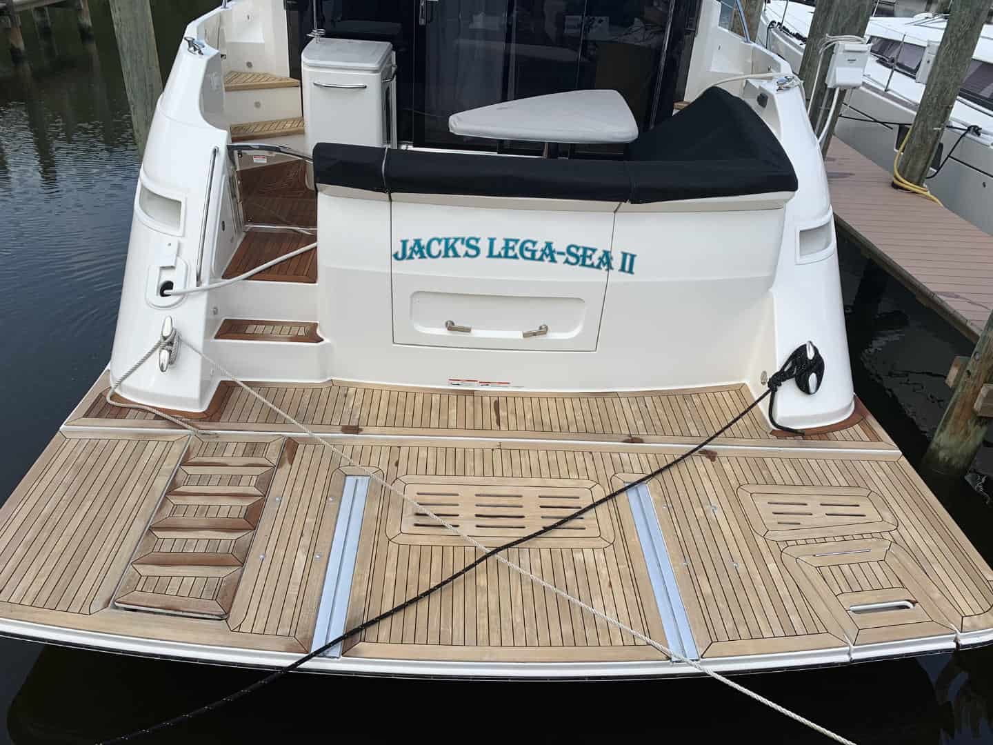 Cleaned teak swim platform on a cruiser